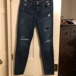 Stretchy distressed wash toothpick jeans